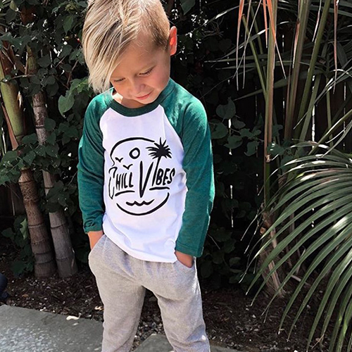 Stylish child wears chill vibes shirt from Animal Crackers boutique