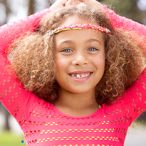 Girl wears Animal Crackers headband and top